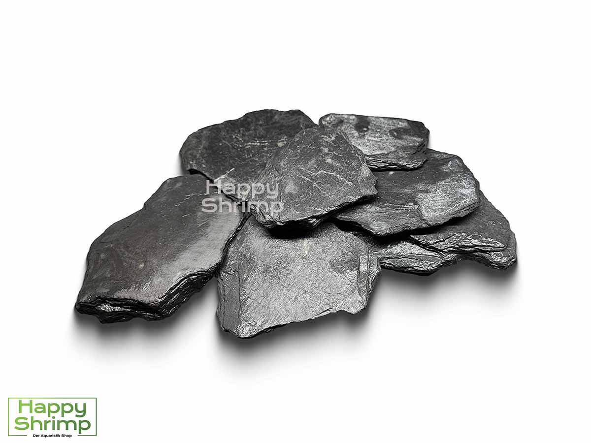 Schwarzer Schiefer Schwarzer Schiefer ist sehr beliebt für die Aquaristik. Dieser Stein ist weder ölhaltig noch härtet es das Wasser auf. Somit geeignet für Weichwasser.