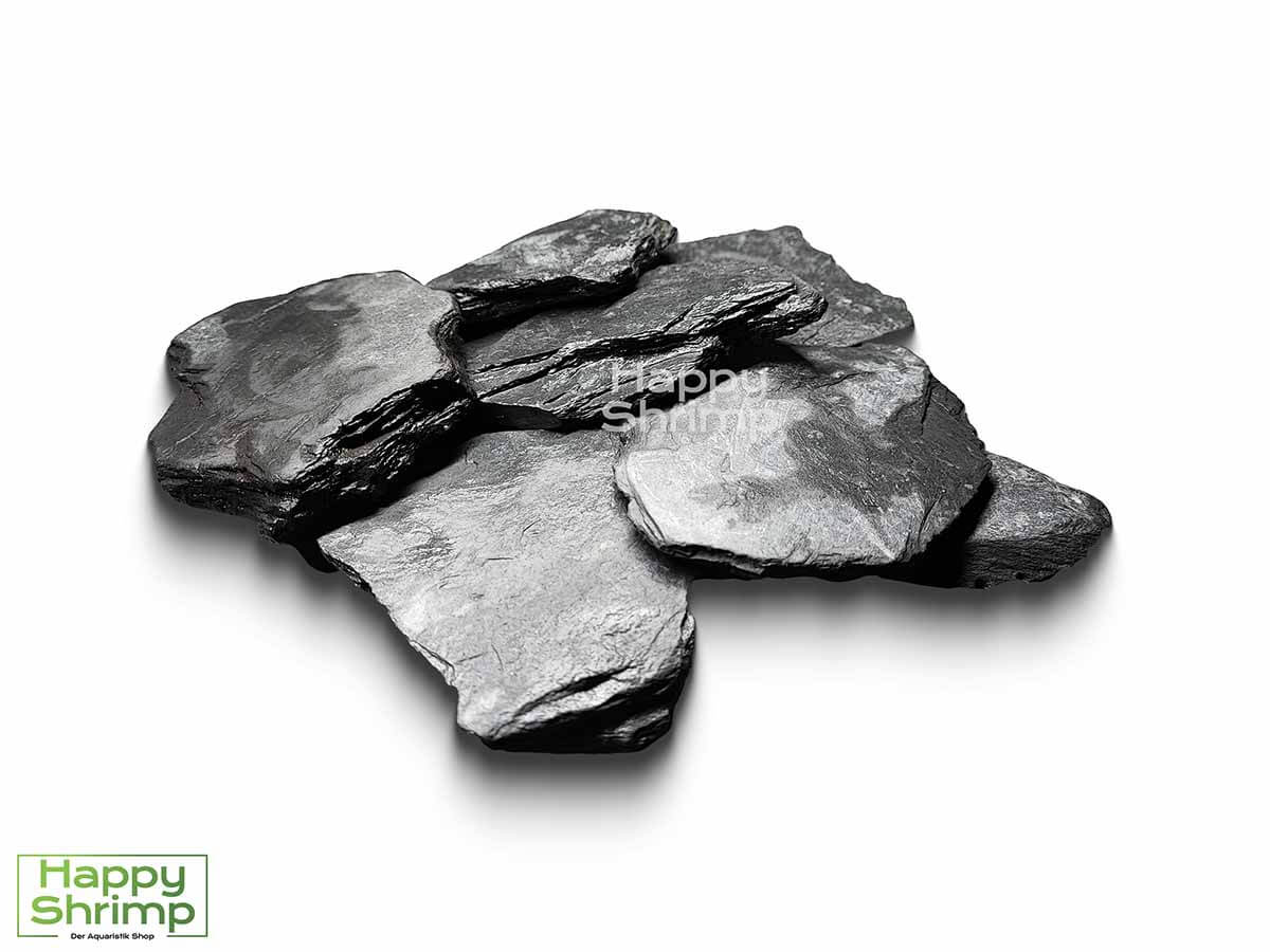 Schwarzer Schiefer2 Schwarzer Schiefer ist sehr beliebt für die Aquaristik. Dieser Stein ist weder ölhaltig noch härtet es das Wasser auf. Somit geeignet für Weichwasser.